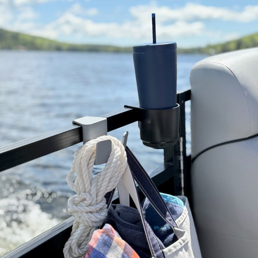 Pontoon boat hook holding bag on water