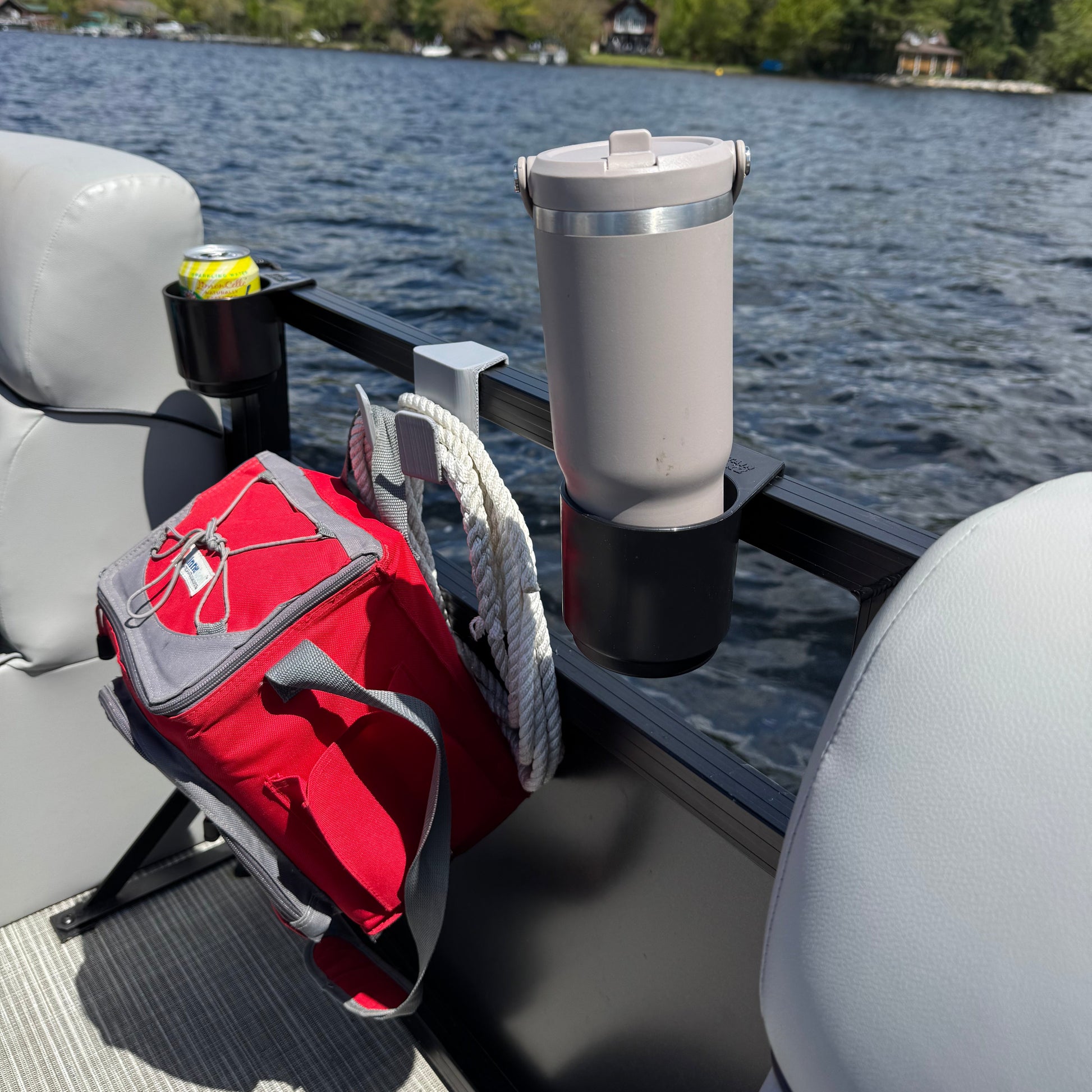 Multi-purpose hook hanging cooler off of ground on pontoon boat